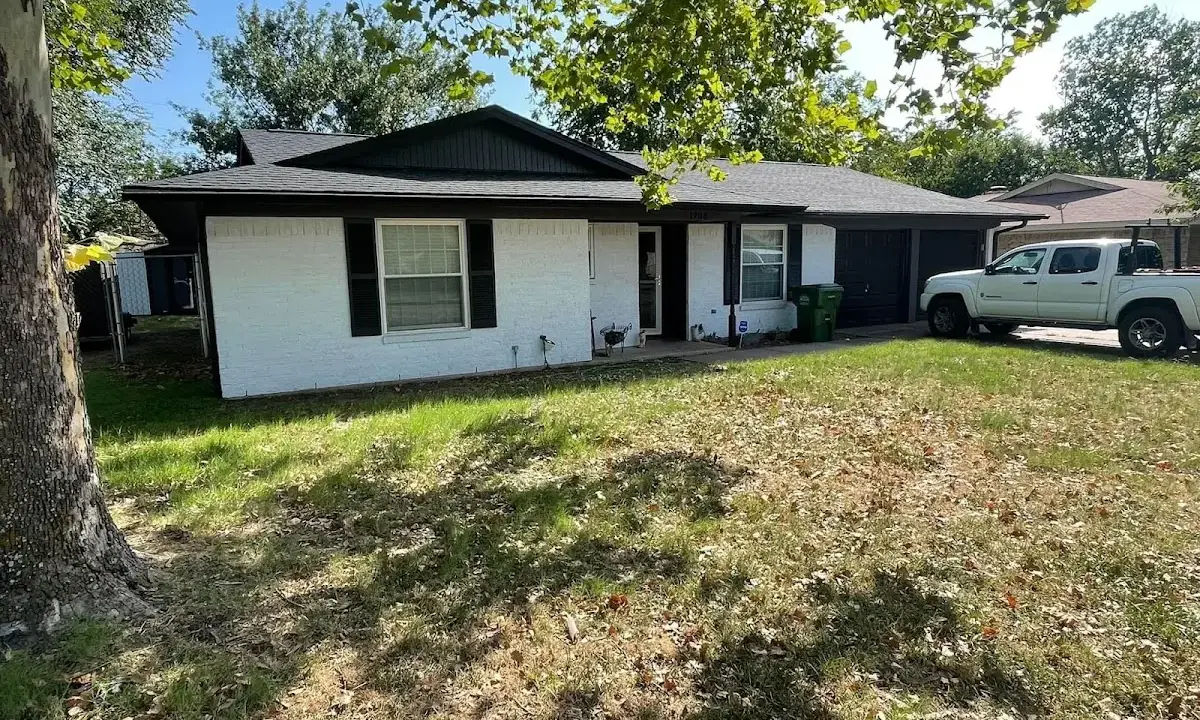 Professional roofing crew working on a residential roof in South Gate Ridge